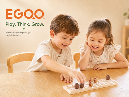 Preschool girl building geometric maze patterns on an Egoo Magnidesk magnetic baseplate, fostering spatial logic and early learning.